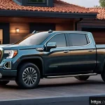 Home 19 지엠 GMC 시에라 EV의 충전 시간 - A sleek GMC Sierra EV electric pickup truck parked at a modern home garage charging station with a 7...
